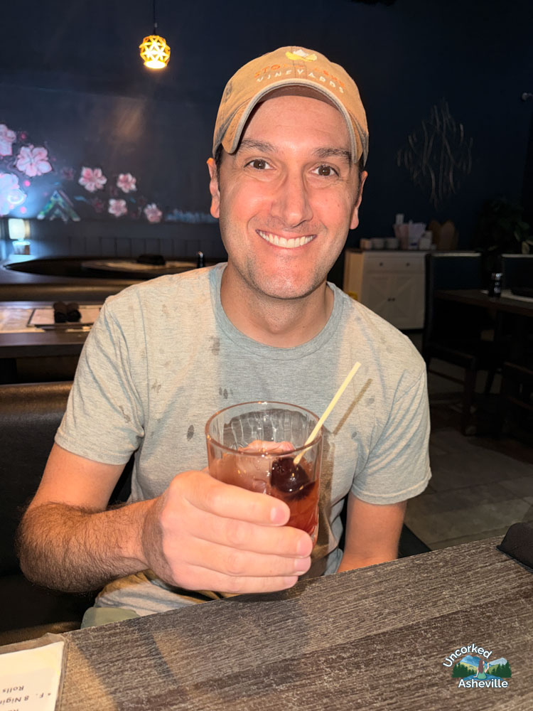 Tom drinking The Madness Cocktail Asheville NC