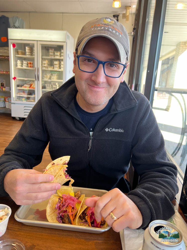Tom eating Mother Ocean fish tacos Asheville NC