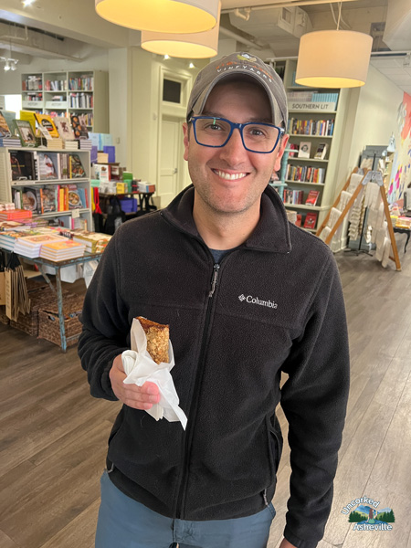 Tom eating pastry at M. Judson Booksellers Greenville SC