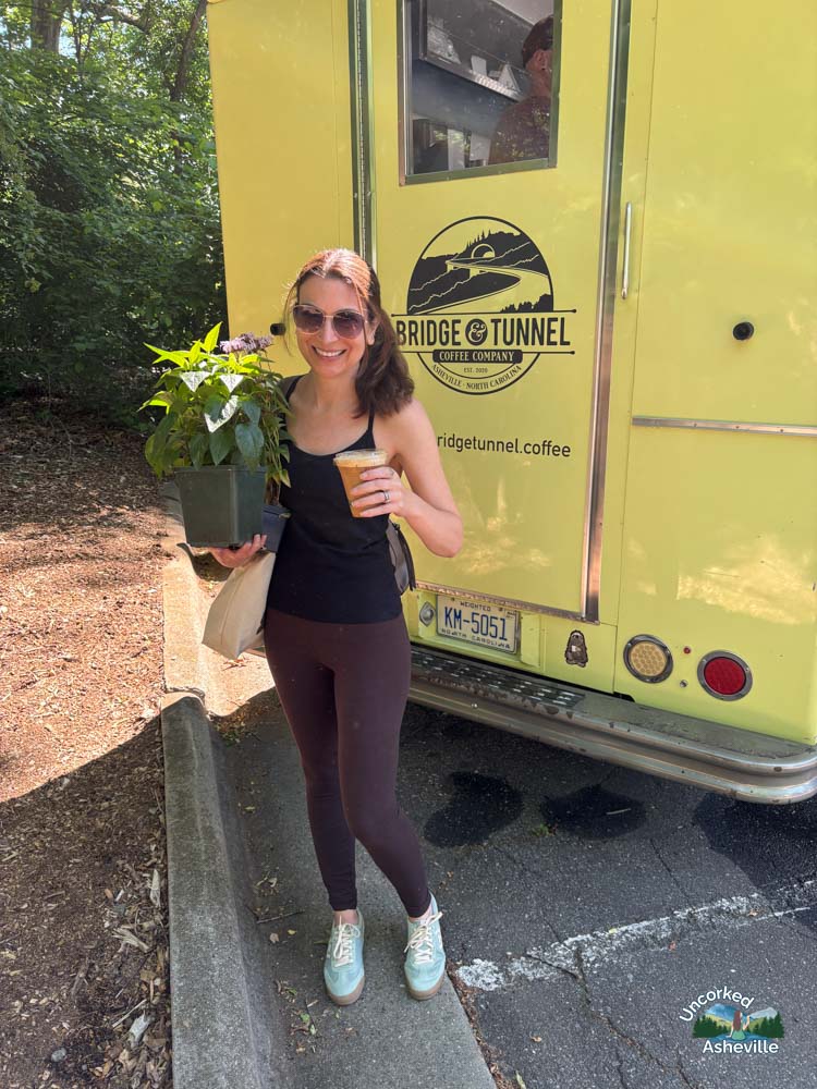 Christine drinking Bridge & Tunnel iced latte North Asheville Tailgate Market