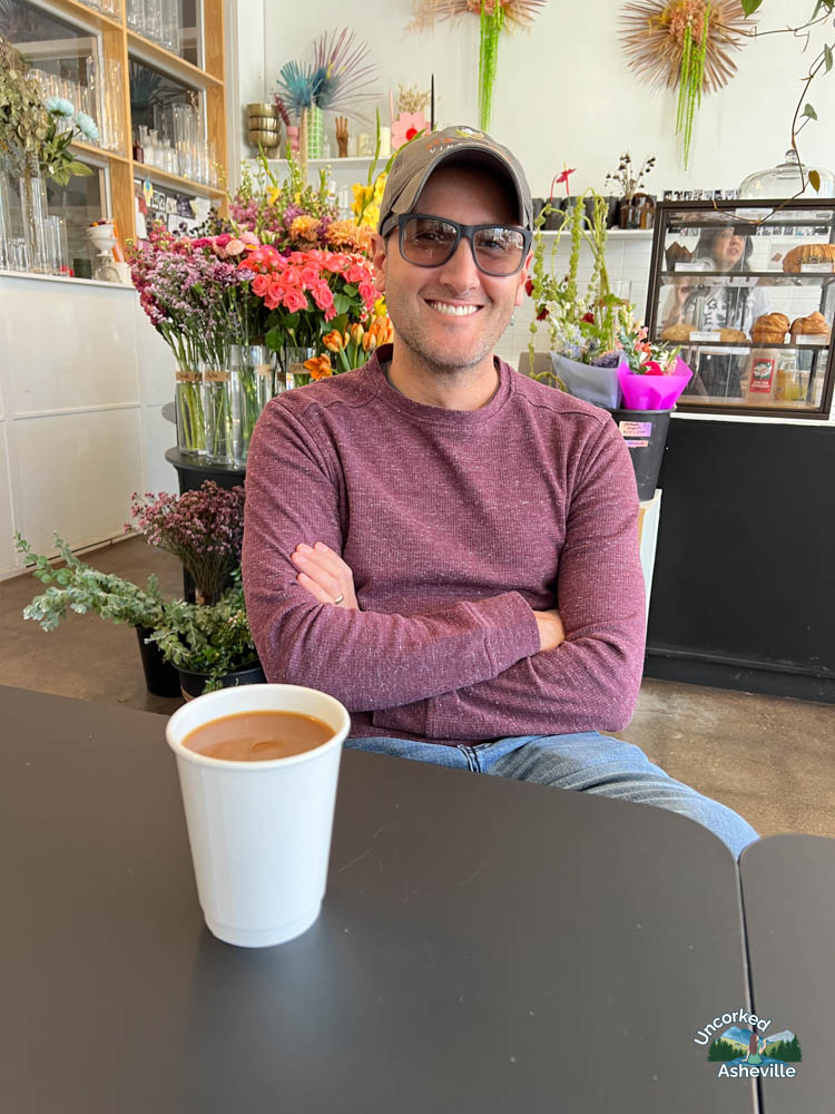 Tom drinking coffee at Pollen Asheville NC