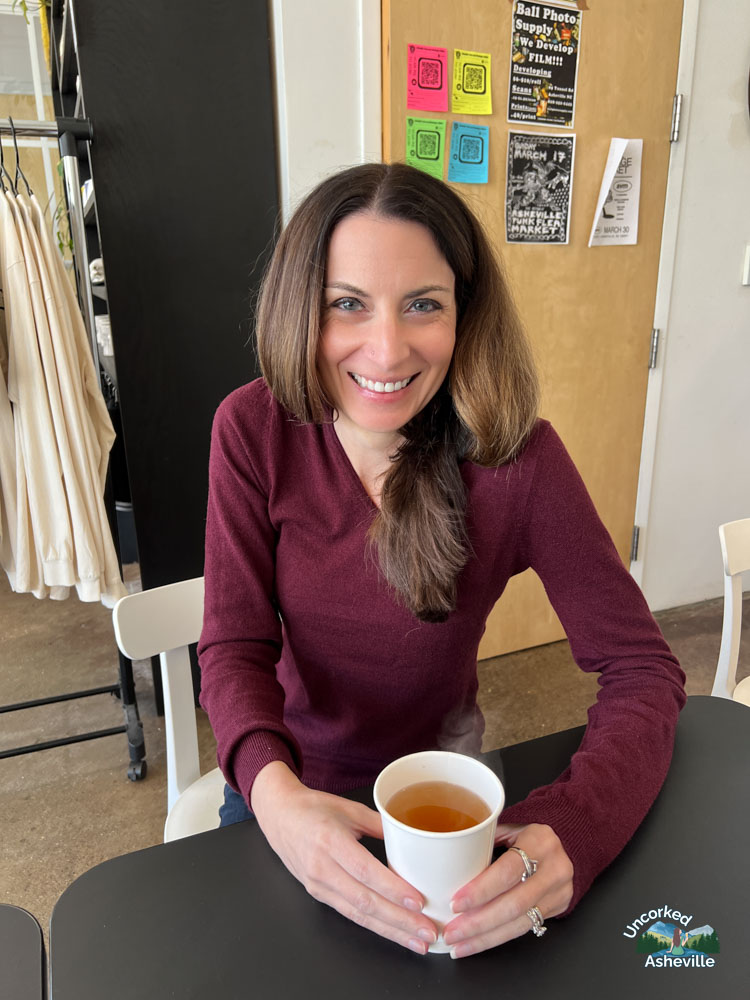 Christine drinking tea at Pollen Coffee & Flower Shop Asheville, NC