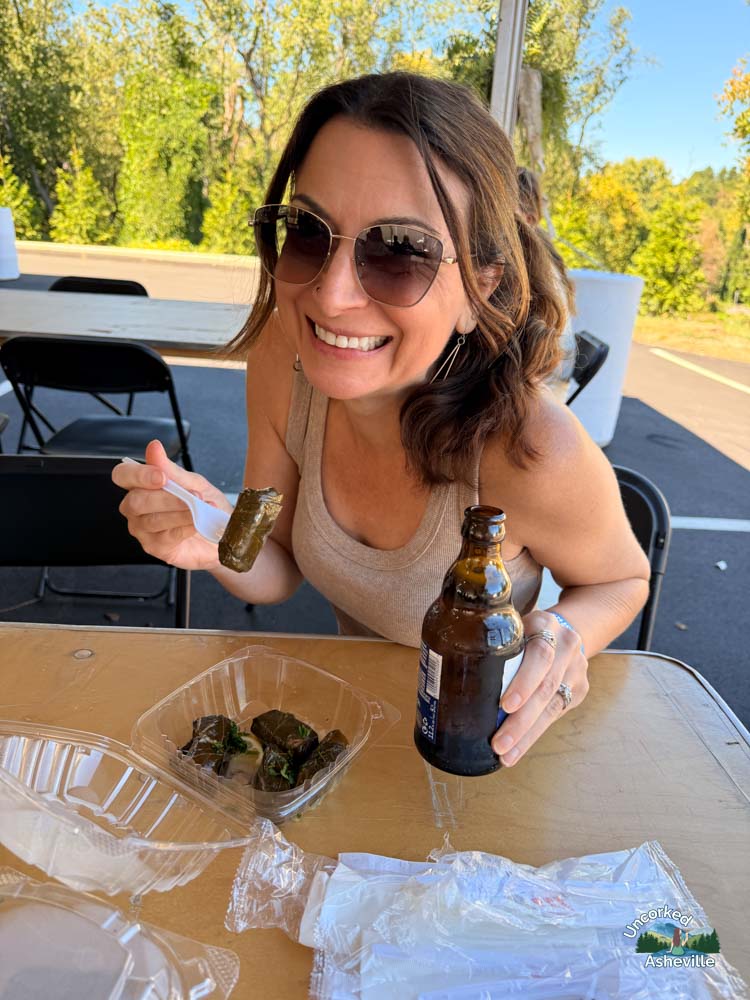 Christine eating dolmades Asheville Greek Festival NC