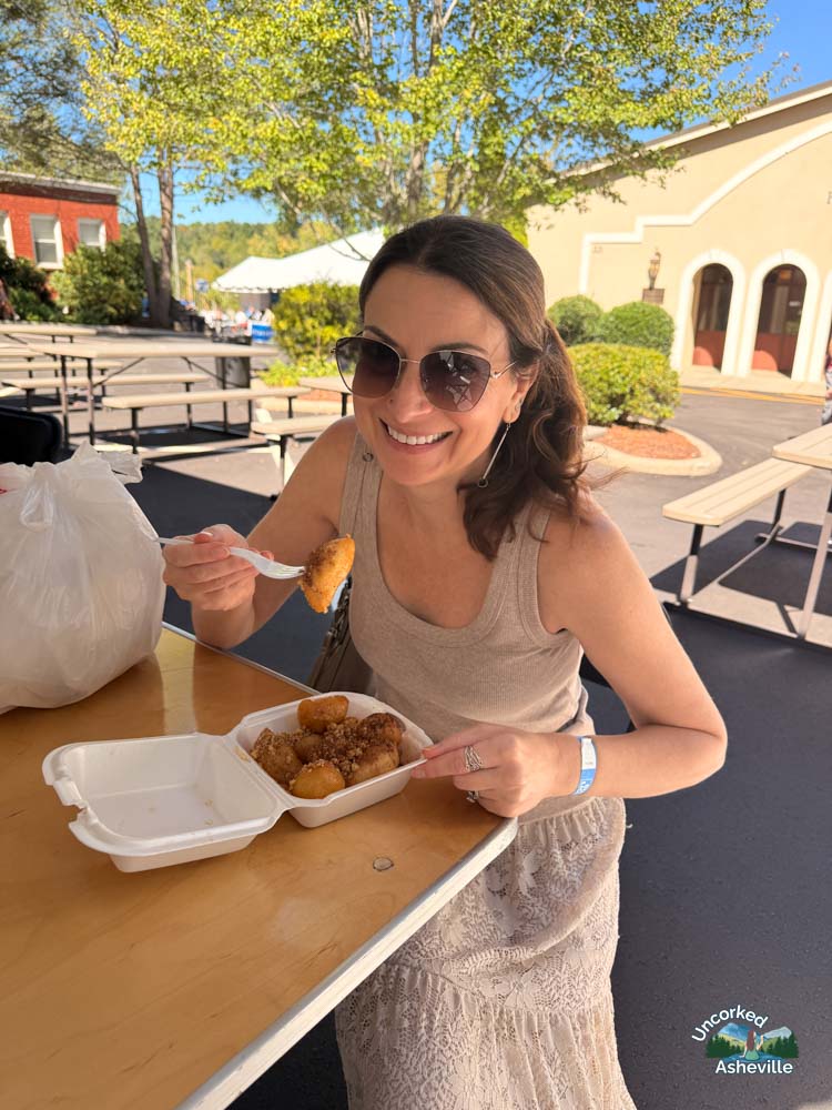 Christine eating Loukoumades Asheville Greek Festival NC